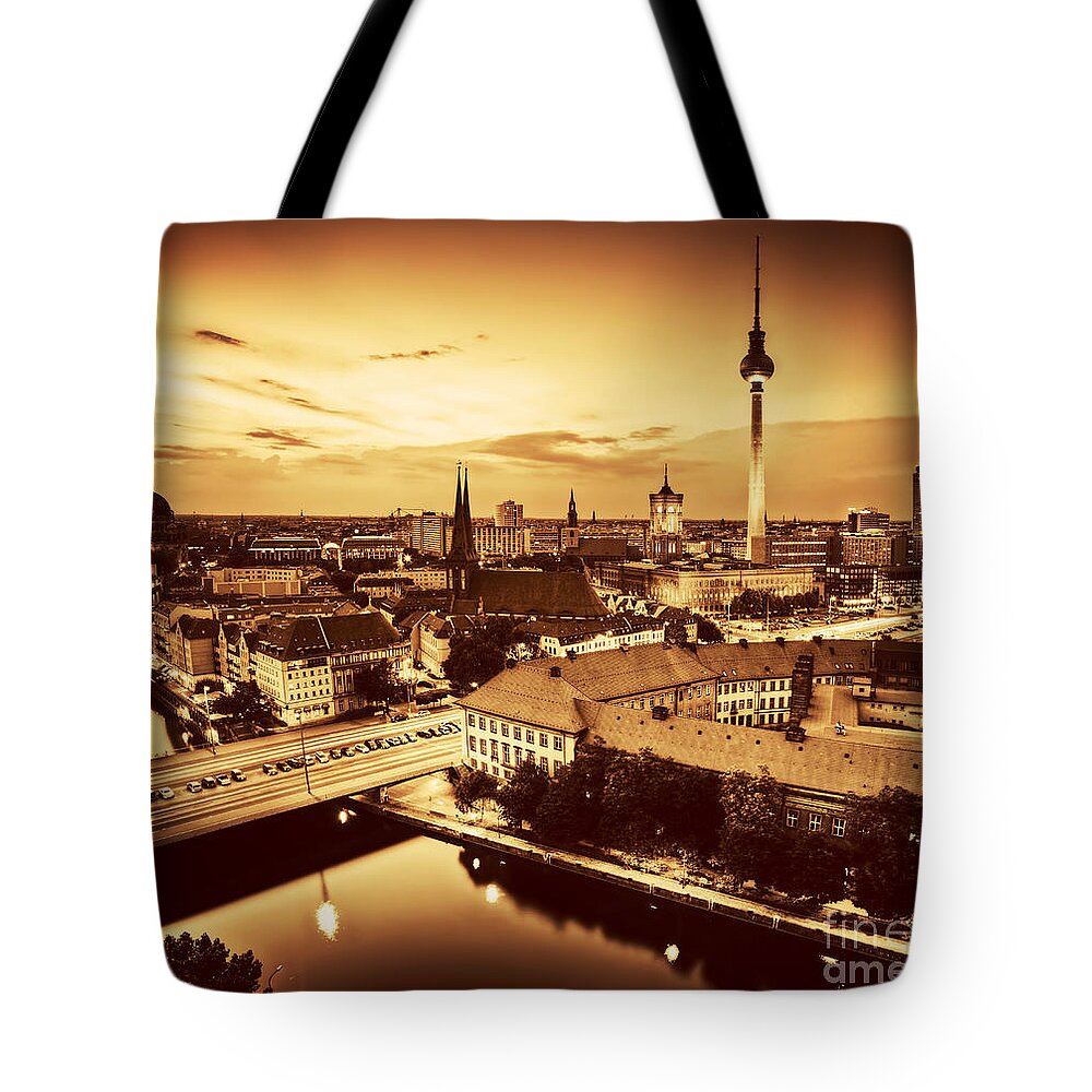 Berlin Tote Bag featuring the photograph Berlin Germany major landmarks at sunset in gold tone by Michal Bednarek