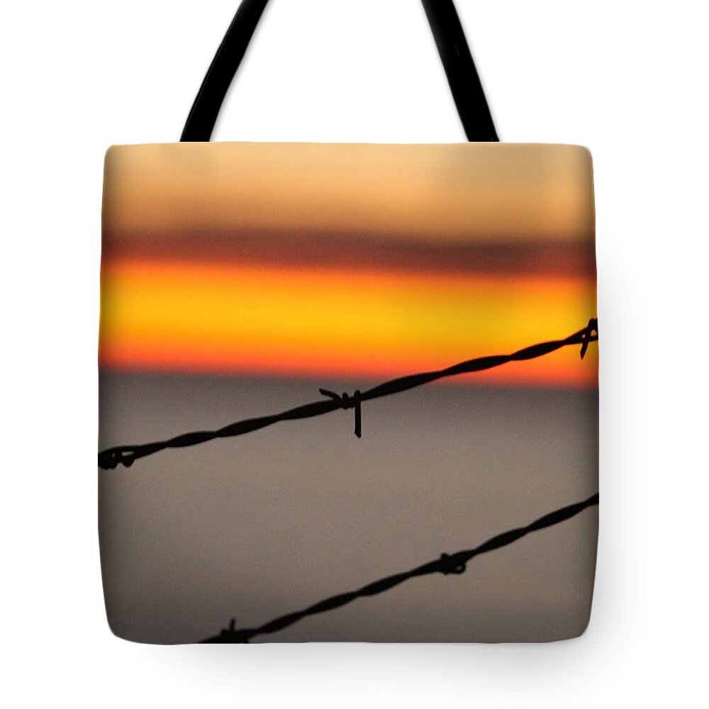 Wire Tote Bag featuring the photograph Beyond The Wire by Amy Gallagher