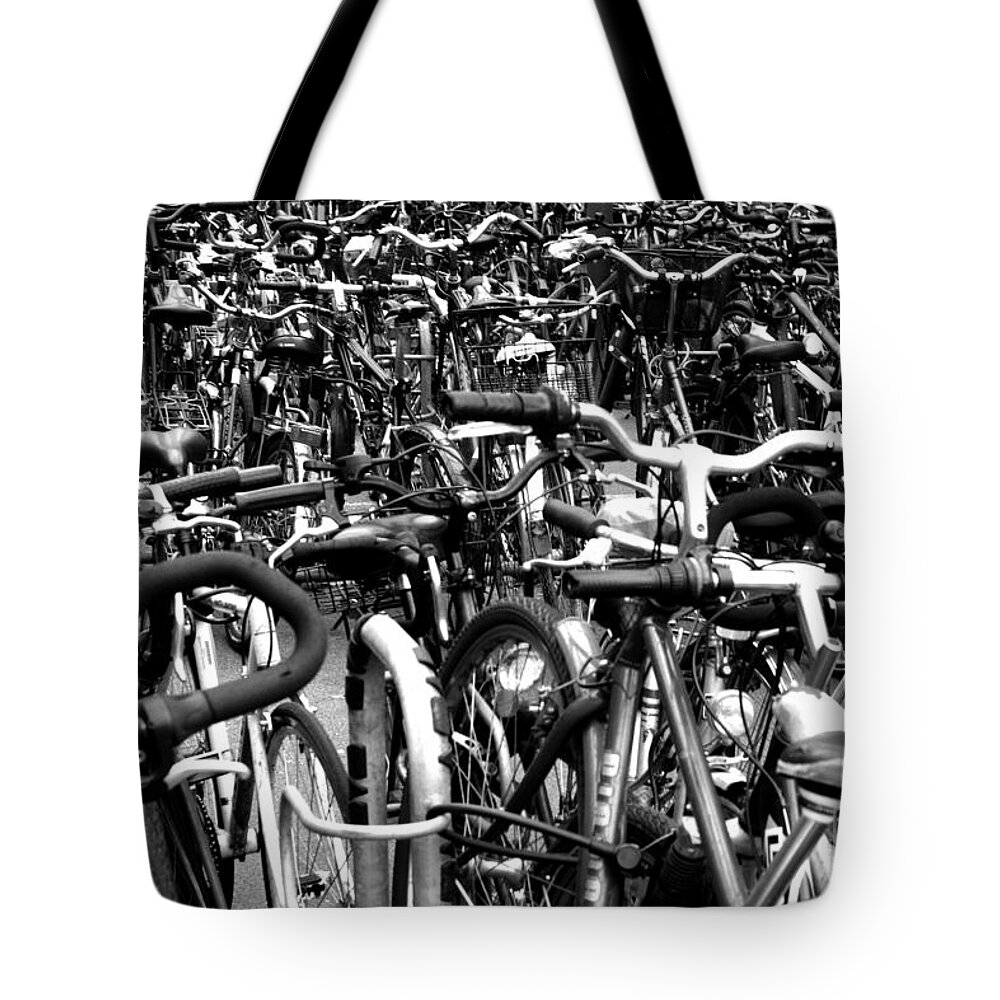 Bikes Tote Bag featuring the photograph Sea of Bicycles- Karlsruhe Germany by Joey Agbayani