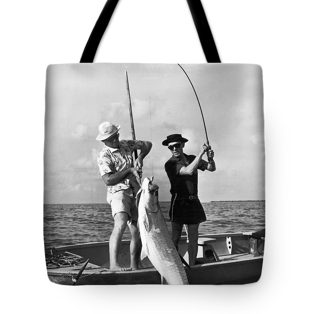 https://render.fineartamerica.com/images/rendered/default/tote-bag/images-medium-5/big-fish-for-a-small-boat-underwood-archives.jpg?&targetx=0&targety=-100&imagewidth=763&imageheight=964&modelwidth=763&modelheight=763&backgroundcolor=D7D7D7&orientation=0&producttype=totebag-18-18