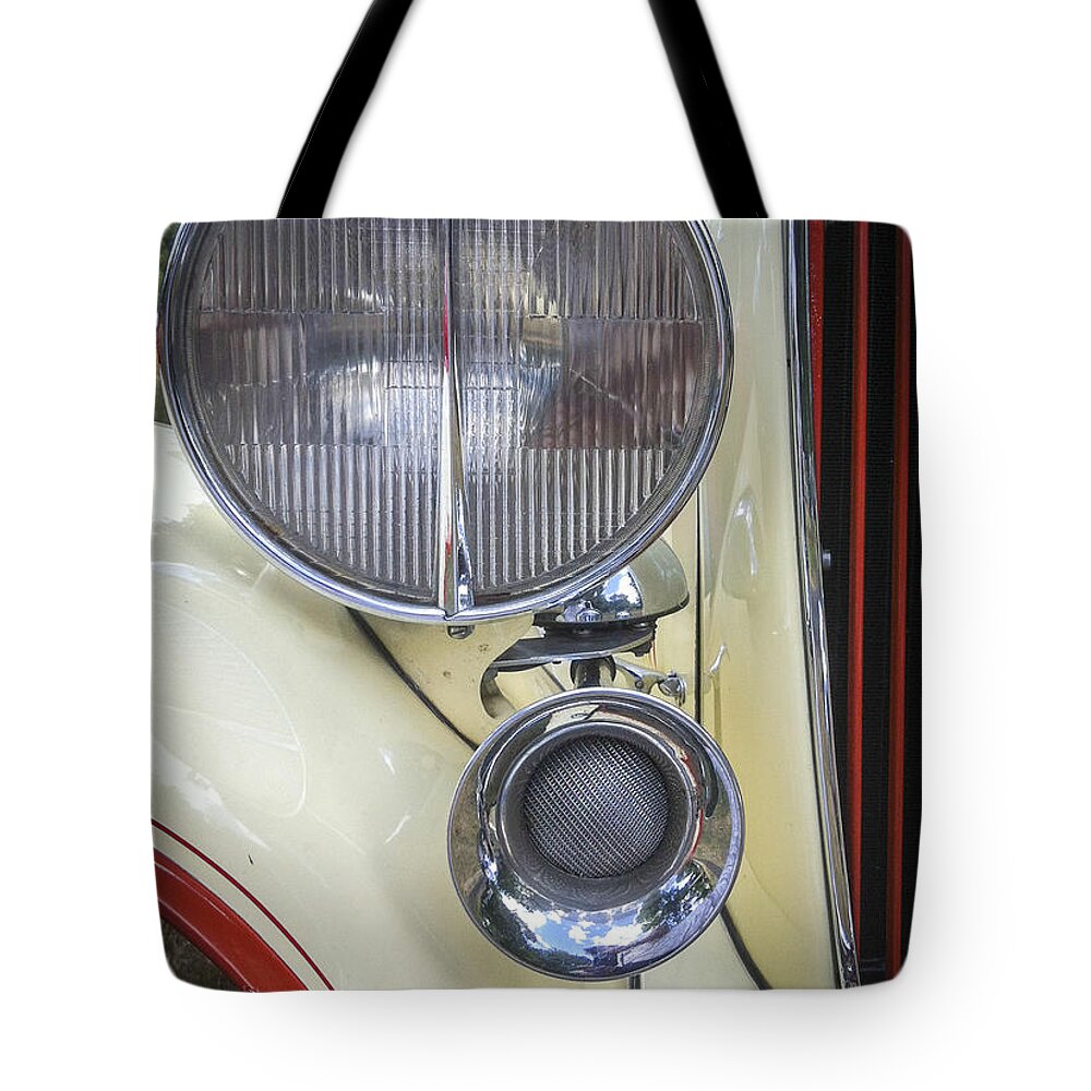 Headlight Tote Bag featuring the photograph Big Light by Jean Noren