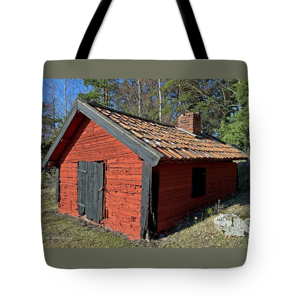 Blacksmiths Workshop Tote Bag featuring the photograph Blacksmiths Workshop by Torbjorn Swenelius