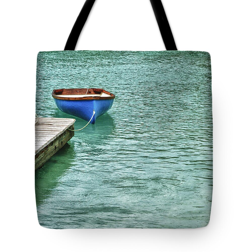 Blue Tote Bag featuring the digital art Blue Boat Off Dock by Michael Thomas