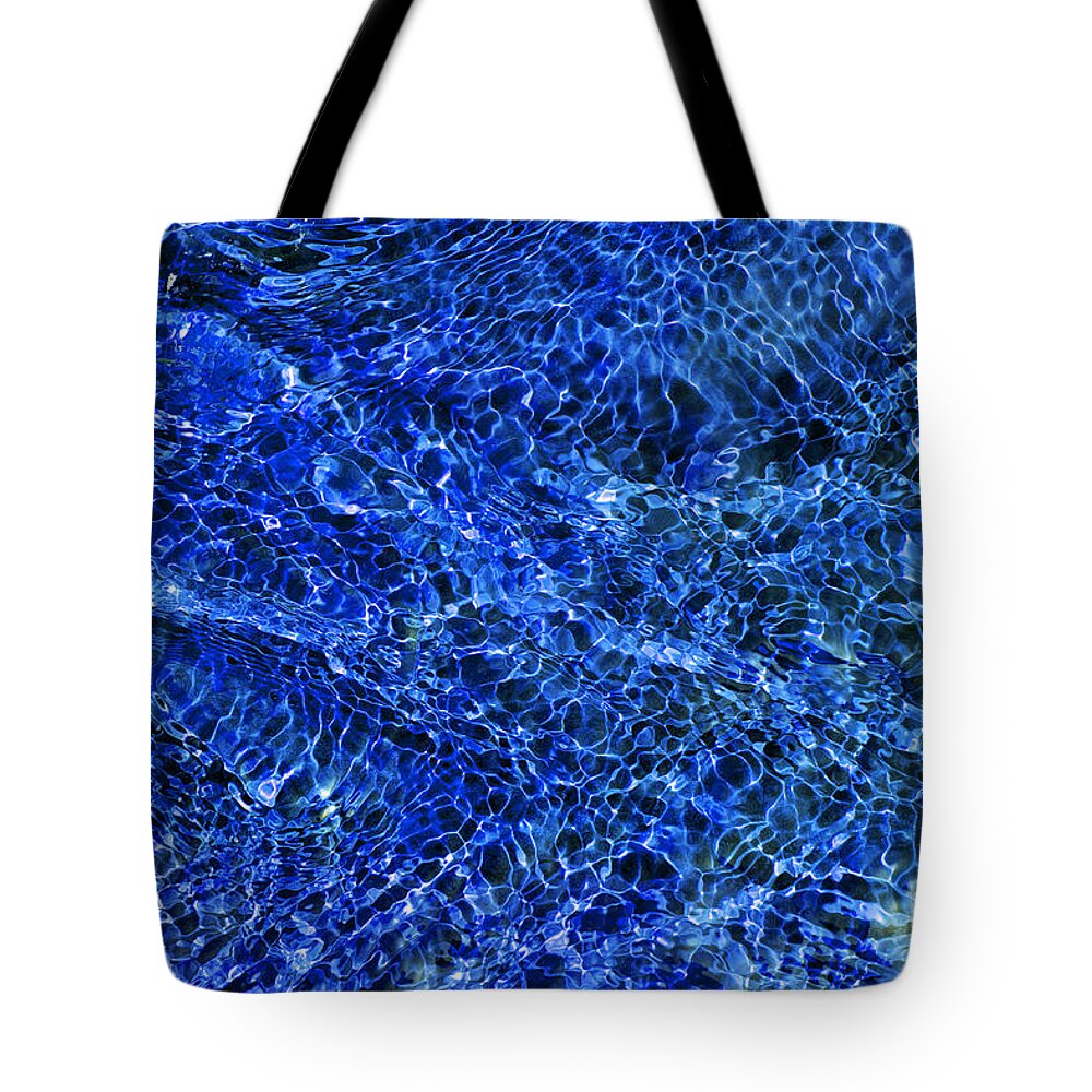 Water Ripples Tote Bag featuring the photograph Blue Rippling Water Pattern by Tim Gainey