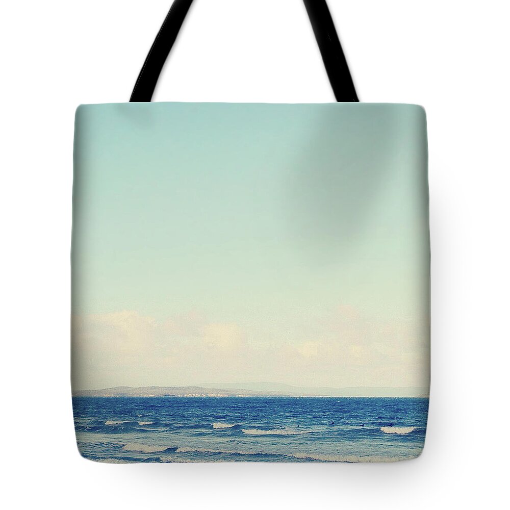 Tranquility Tote Bag featuring the photograph Blue Skies Over Ocean by Jodie Griggs