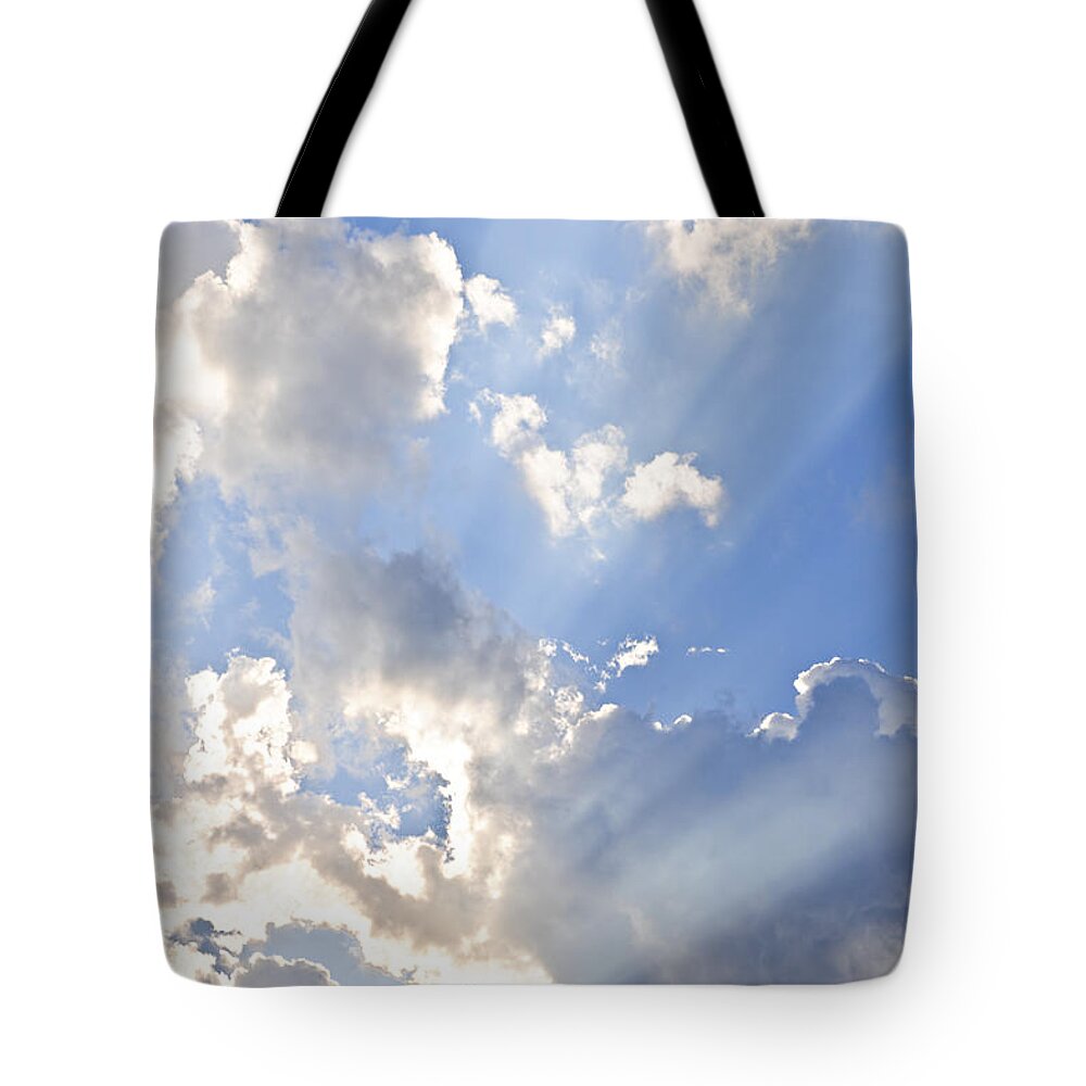 Sky Tote Bag featuring the photograph Blue sky with sun rays by Elena Elisseeva