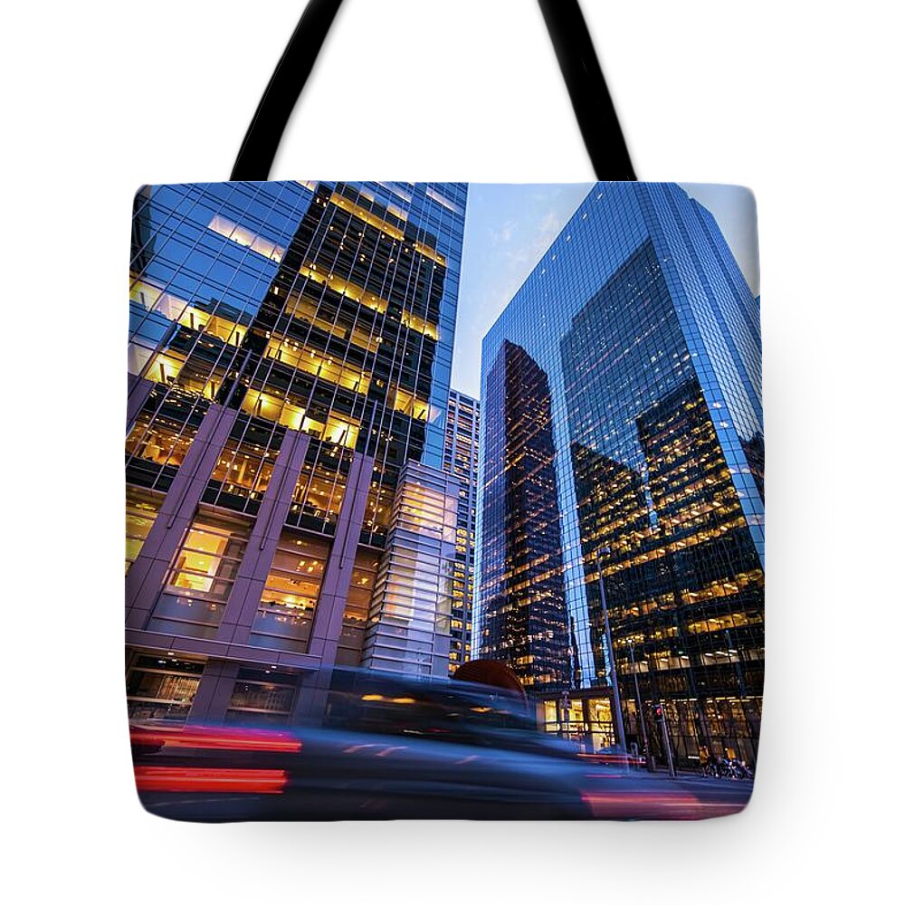 Downtown District Tote Bag featuring the photograph Blurred Car Lights In Motion On Street by Larabelova