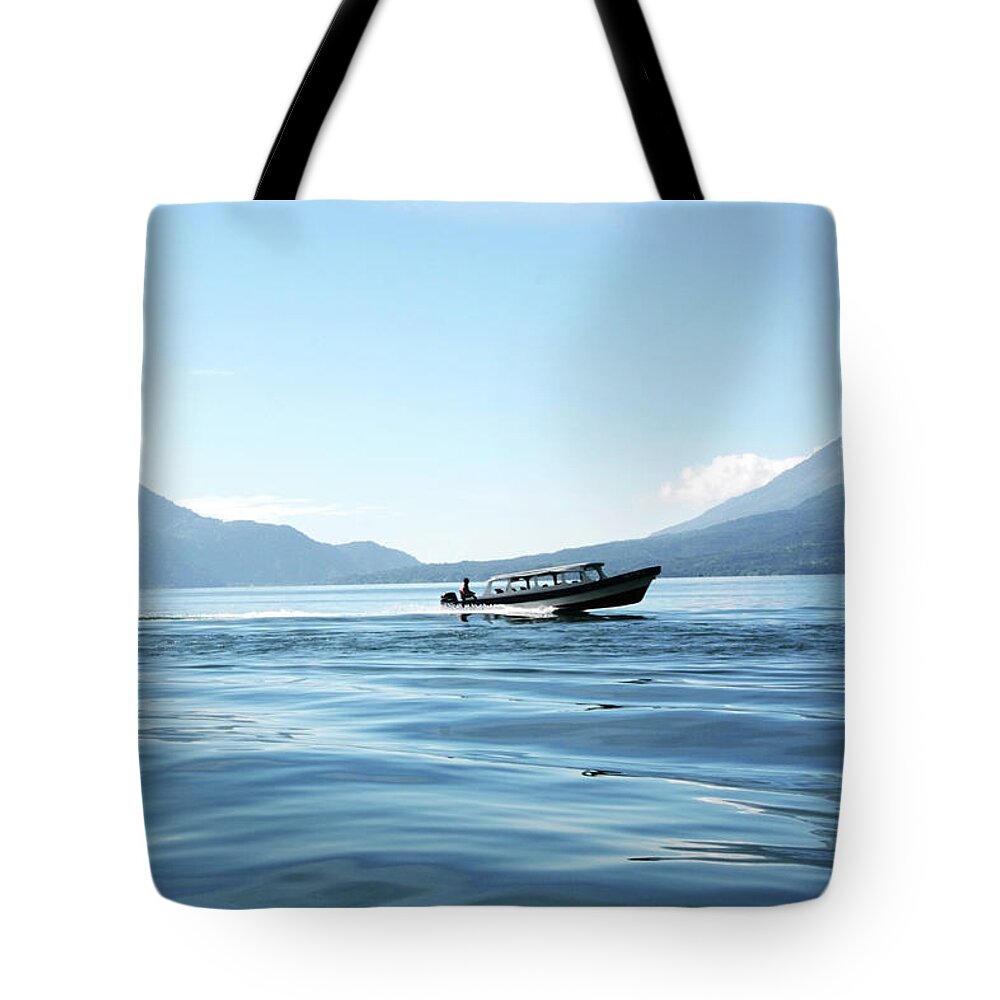 Scenics Tote Bag featuring the photograph Boat At Full Speed On Lake Atitlan In by Lubilub