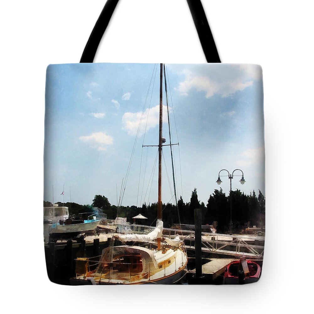 Cabin Cruiser Tote Bag featuring the photograph Boat - Docked Cabin Cruiser by Susan Savad