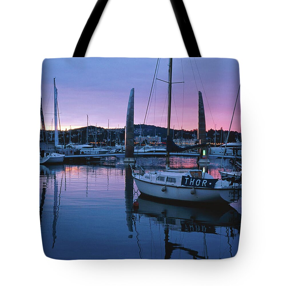 England Tote Bag featuring the photograph Boats Moored In Harbour At Sunset by David C Tomlinson