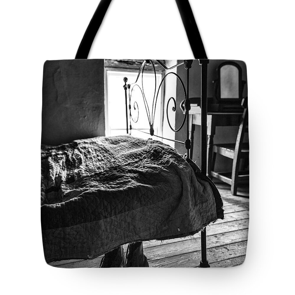Boots Tote Bag featuring the photograph Boots under the bed by Nigel R Bell