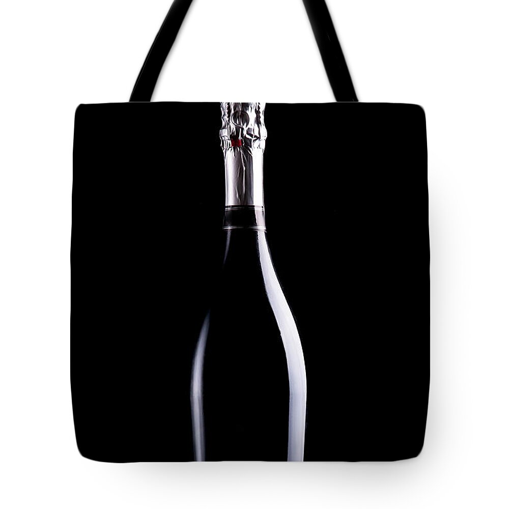 Alcohol Tote Bag featuring the photograph Bottle Of Champagne by Goodlifestudio