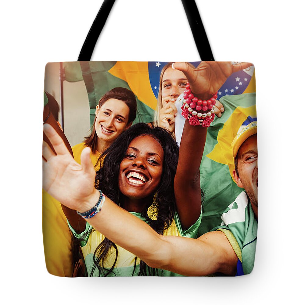 Atmosphere Tote Bag featuring the photograph Brazilian Fans At Stadium by Filippobacci