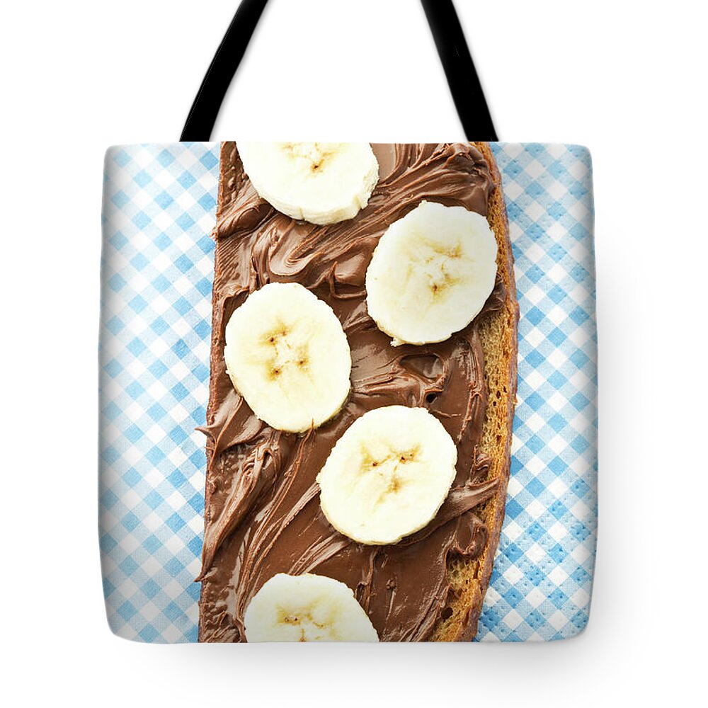White Background Tote Bag featuring the photograph Bread Topped With Nutella And Banana by Westend61