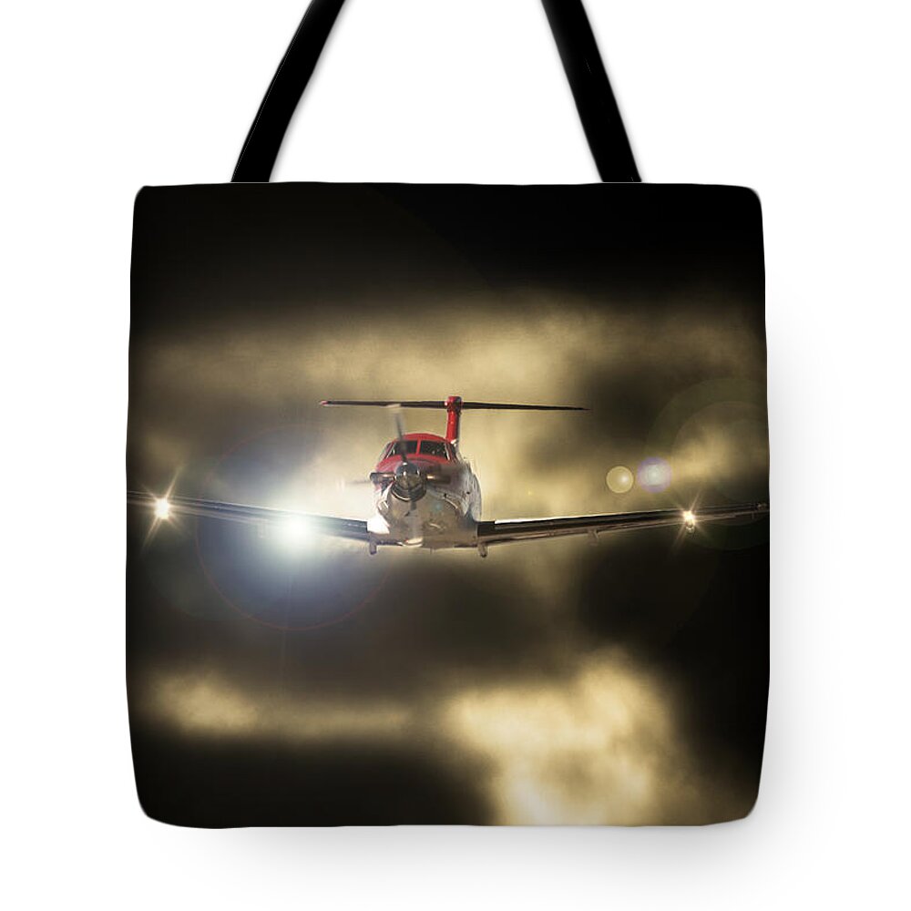 Pilatus Pc12 Golden Eagle Tote Bag featuring the photograph Bright Light by Paul Job