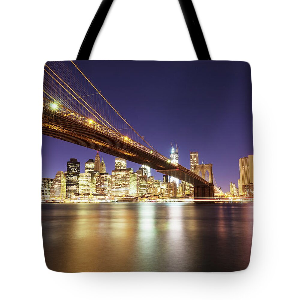 Lower Manhattan Tote Bag featuring the photograph Brooklyn Bridge And Manhattan Skyline by Mlenny