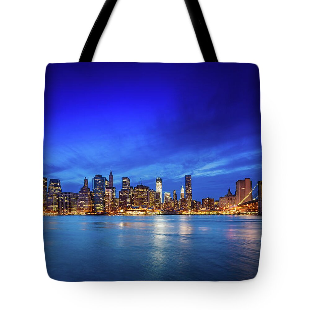Lower Manhattan Tote Bag featuring the photograph Brooklyn Bridge With Downtown by Mbbirdy