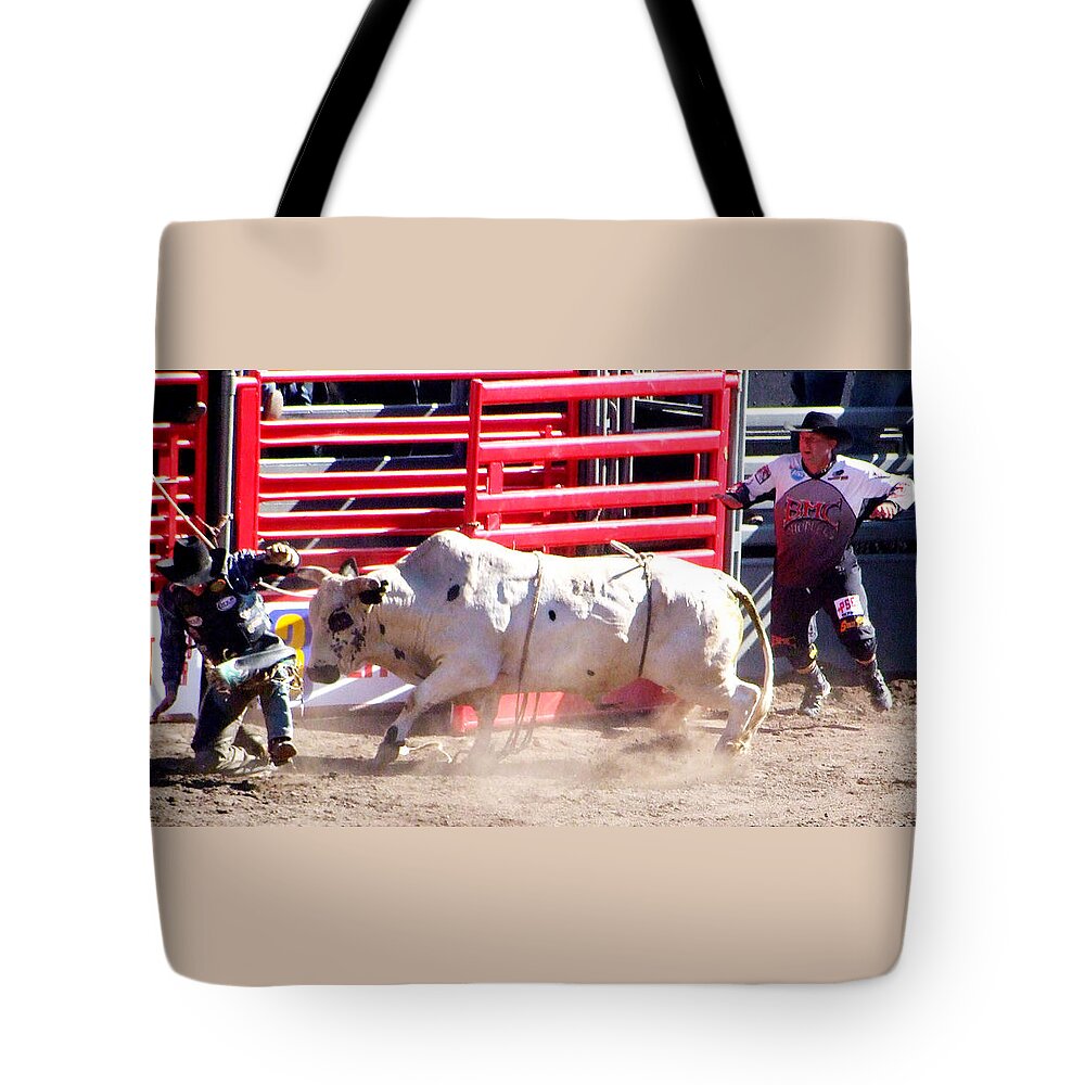 Cowboy Tote Bag featuring the photograph Bull after the Rider by Ron Roberts