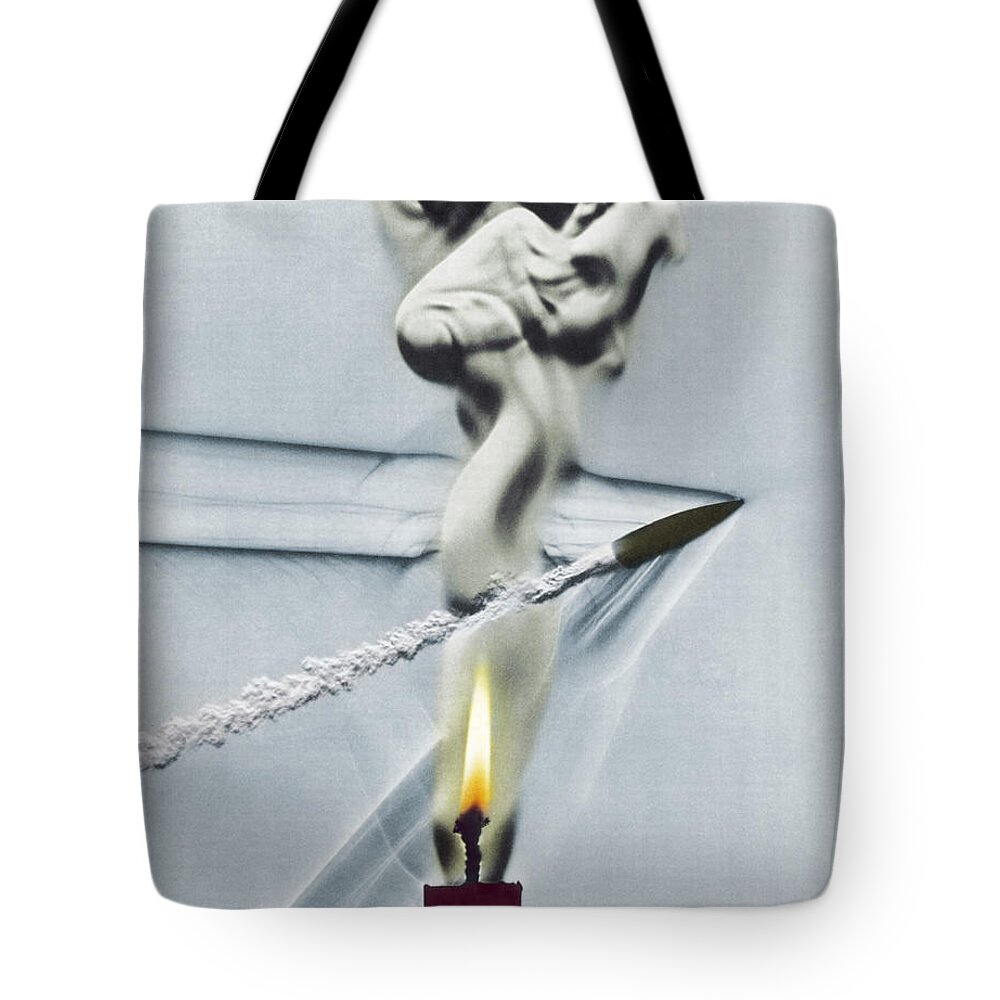 High-speed Photography Tote Bag featuring the photograph Bullet Shot Through Candle Flame by Science Source