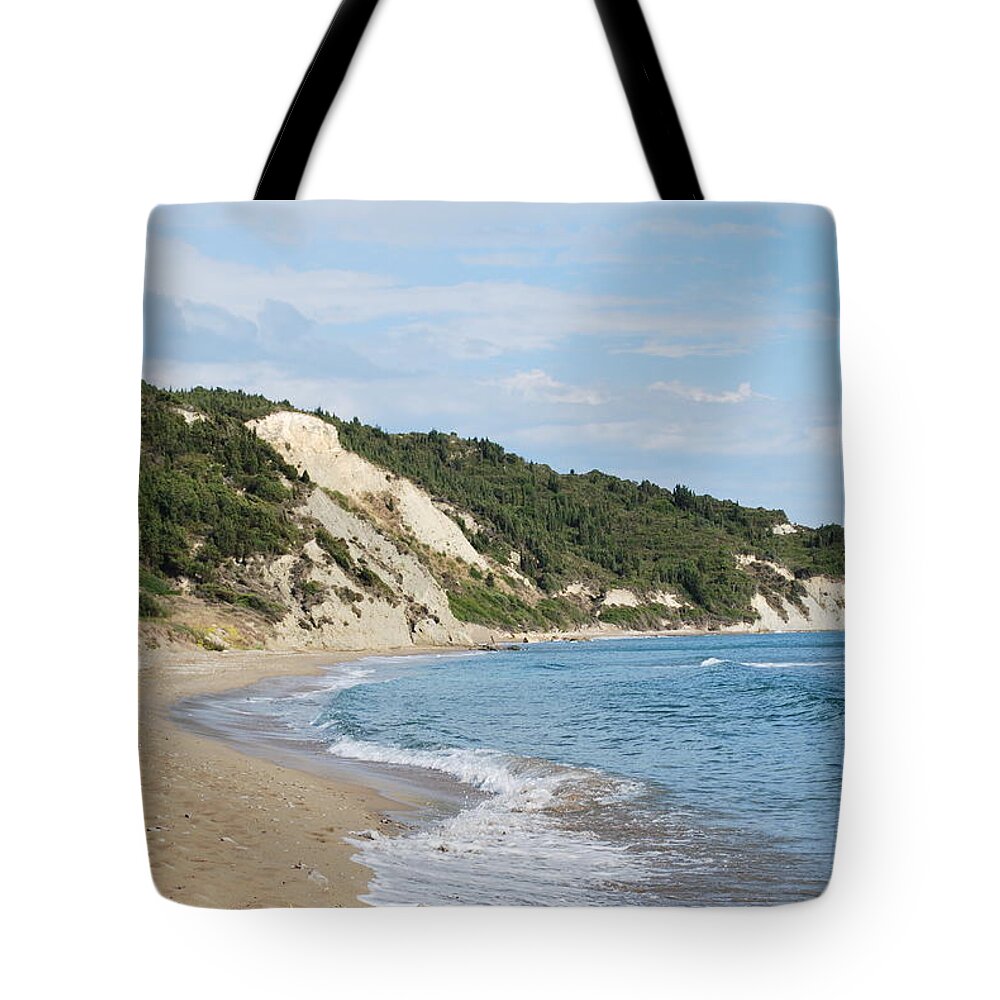 Beach Tote Bag featuring the photograph By the beach by George Katechis
