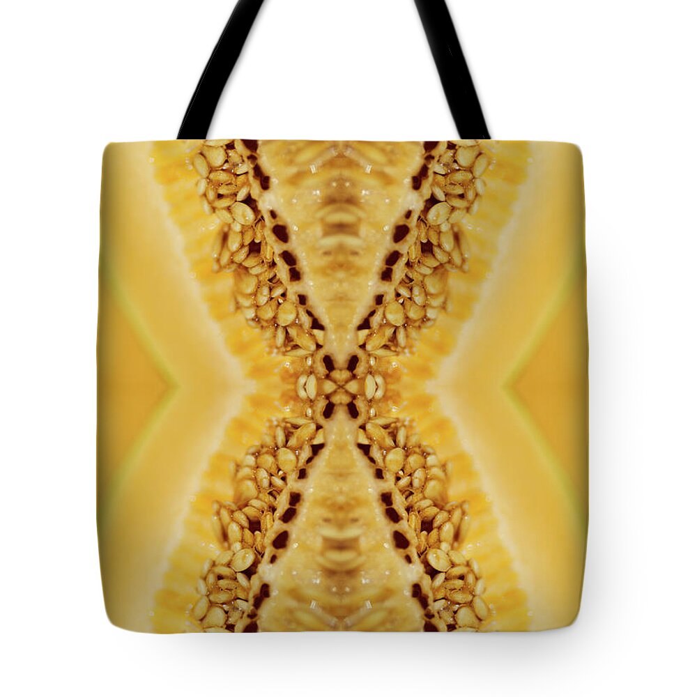 Cantaloupe Tote Bag featuring the photograph Cantaloupe Seeds Inside A Freshly Cut by Silvia Otte