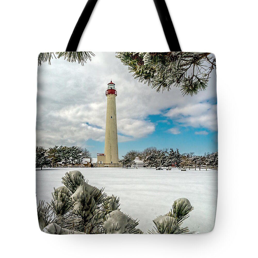 Beacon Tote Bag featuring the photograph Cape May Light thru Snowy Trees by Nick Zelinsky Jr