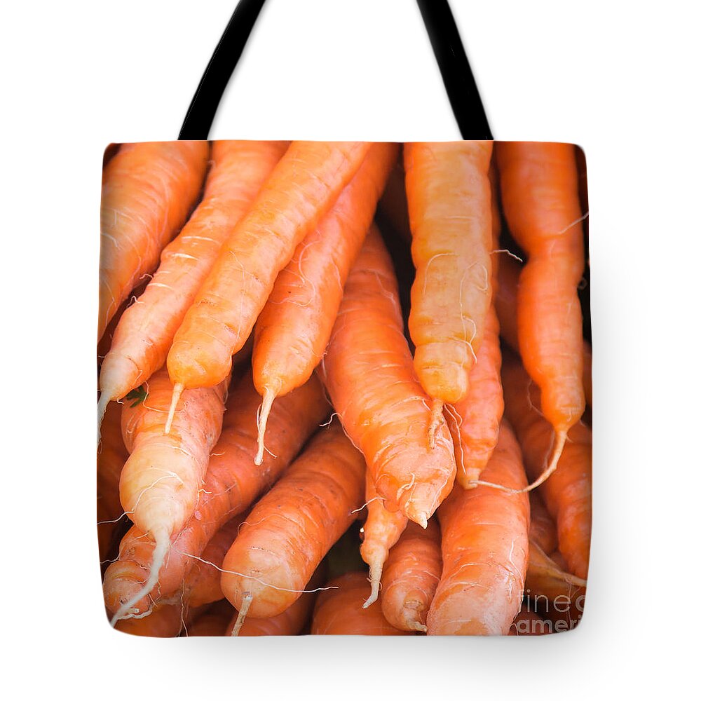 Carrots Tote Bag featuring the photograph Carrots by Rebecca Cozart
