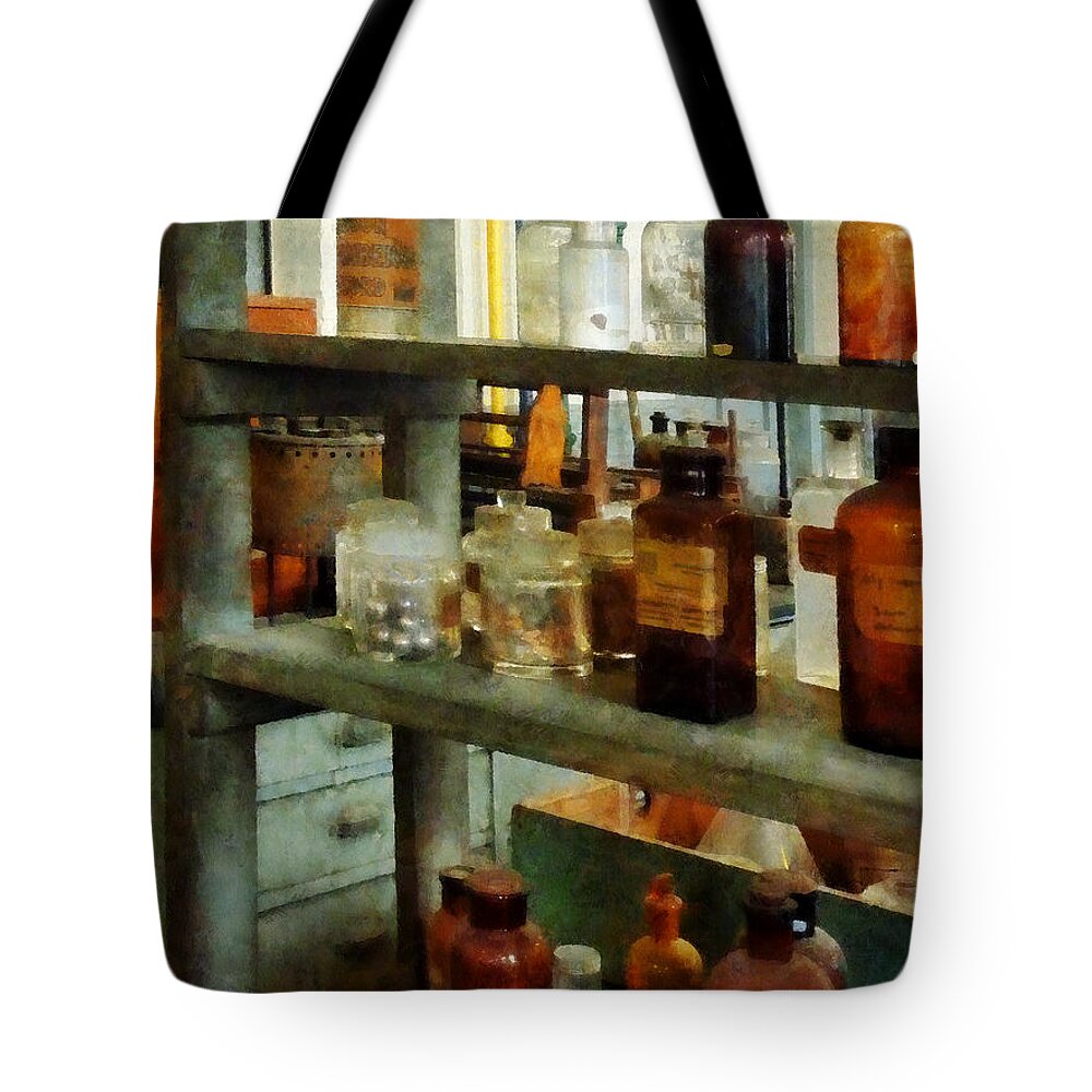 Science Tote Bag featuring the photograph Chemist - Bottles of Chemicals Tall and Short by Susan Savad