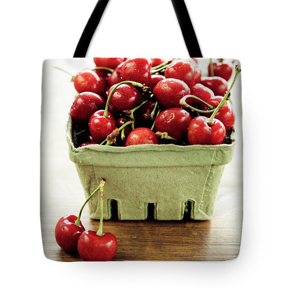 Cherry Tote Bag featuring the photograph Cherries by Mmeemil