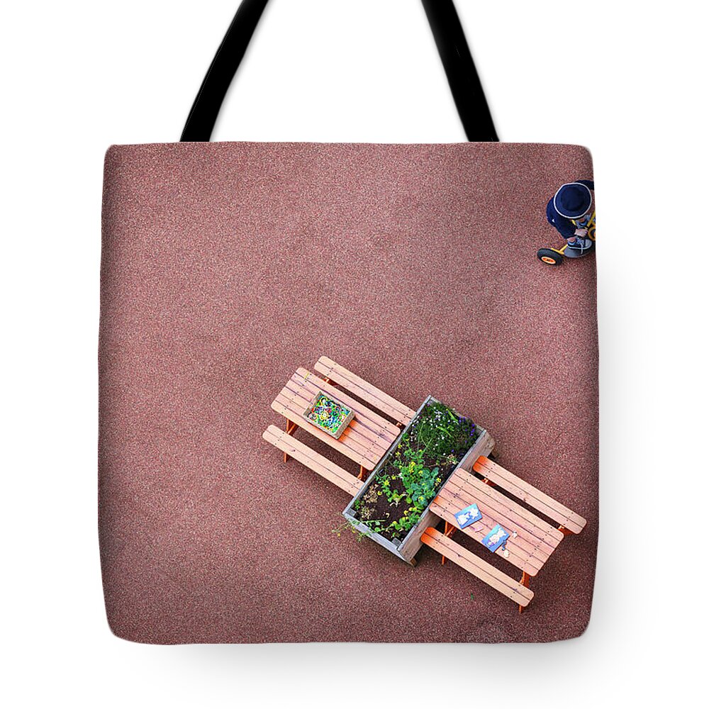 Preschool Building Tote Bag featuring the photograph Child Playing by Mikulas1