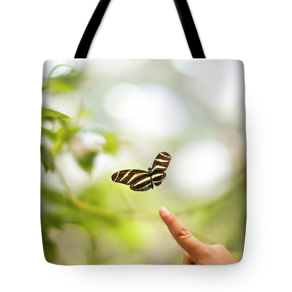 Petaluma Tote Bag featuring the photograph Child Points To Butterfly by Ae Pictures Inc.