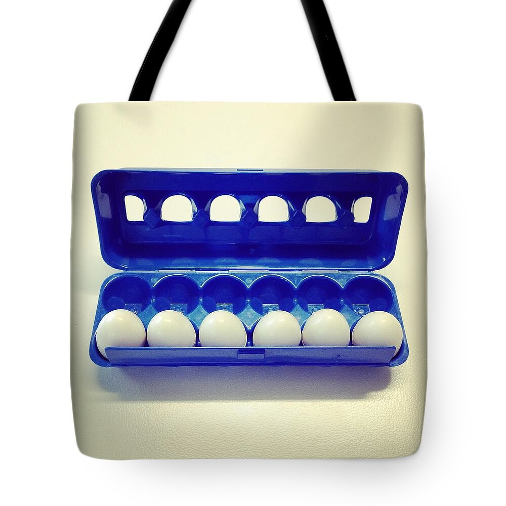 In A Row Tote Bag featuring the photograph Childs Plastic Toy by Jodie Griggs