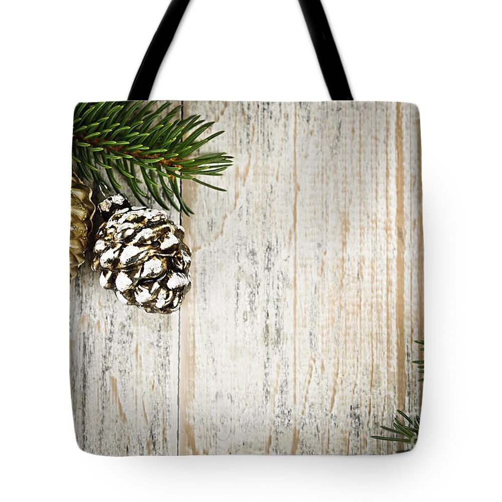 Christmas Tote Bag featuring the photograph Christmas ornaments with pine branches by Elena Elisseeva