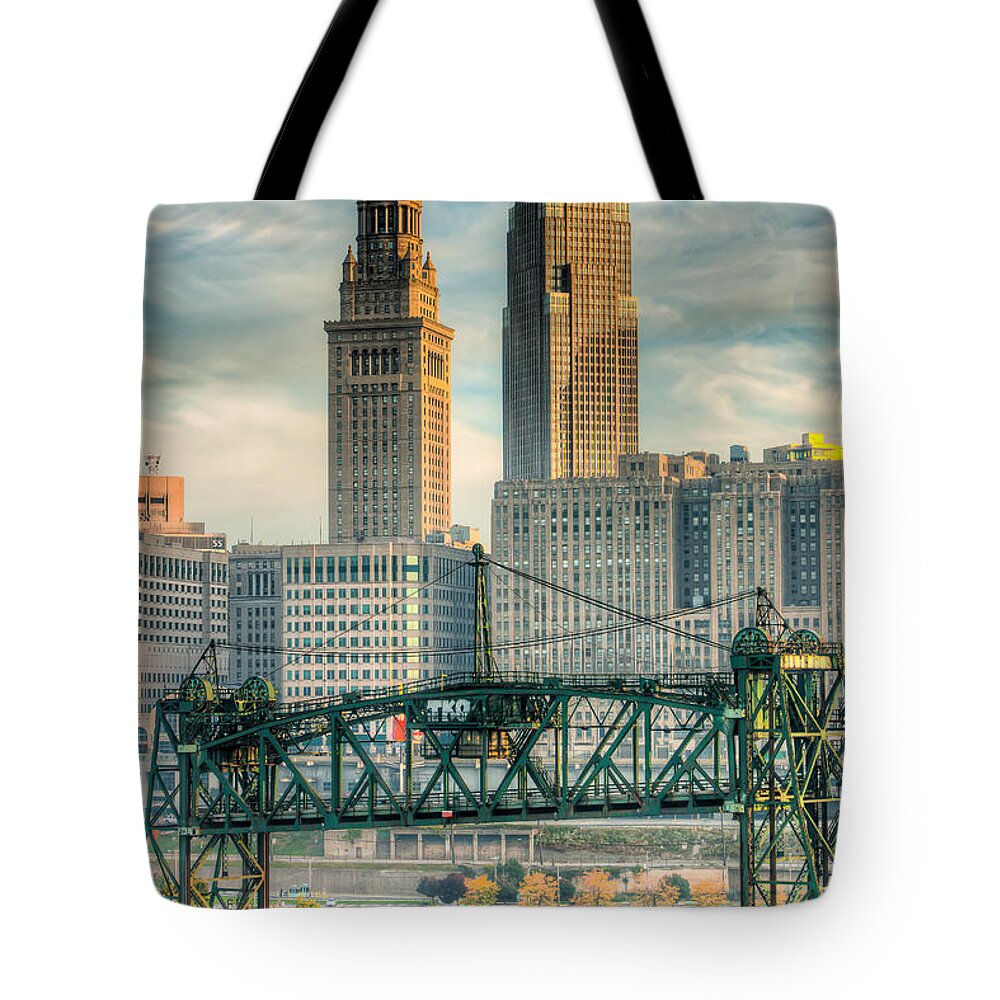 Clarence Holmes Tote Bag featuring the photograph Cleveland Skyline and the Flats I by Clarence Holmes