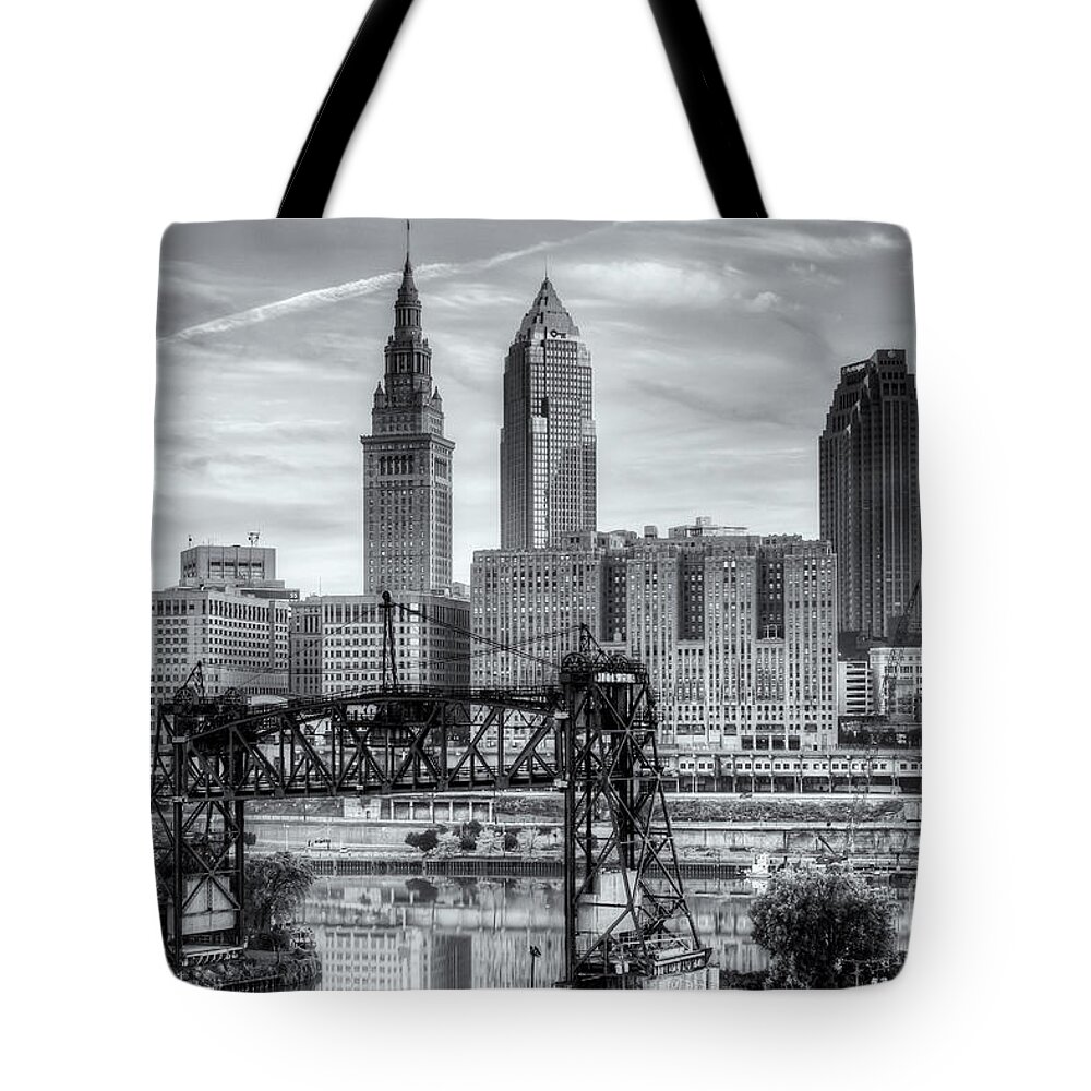 Clarence Holmes Tote Bag featuring the photograph Cleveland Skyline and the Flats VI by Clarence Holmes