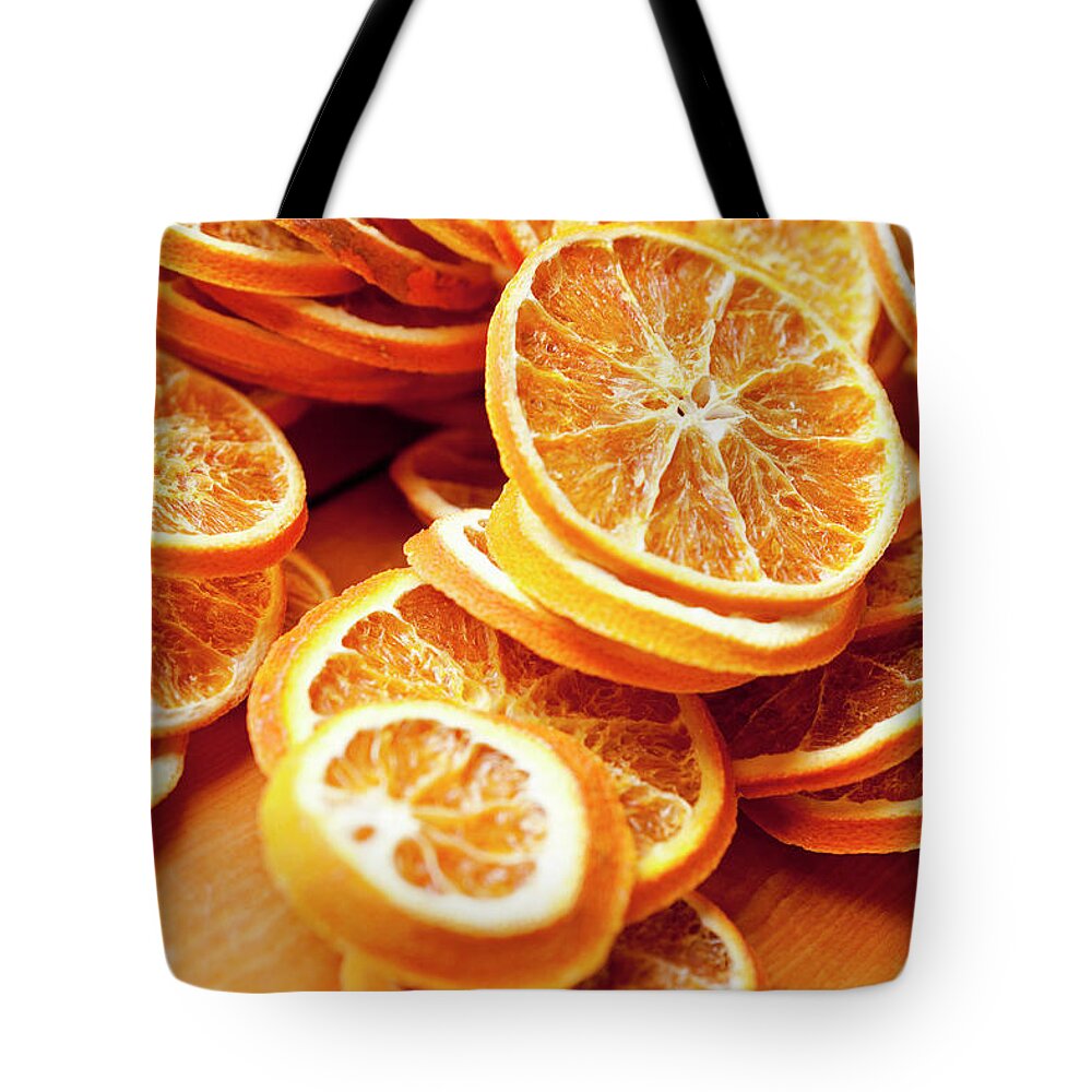 Orange Tote Bag featuring the photograph Close Up Of Dried Orange Slices by Nils Hendrik Mueller