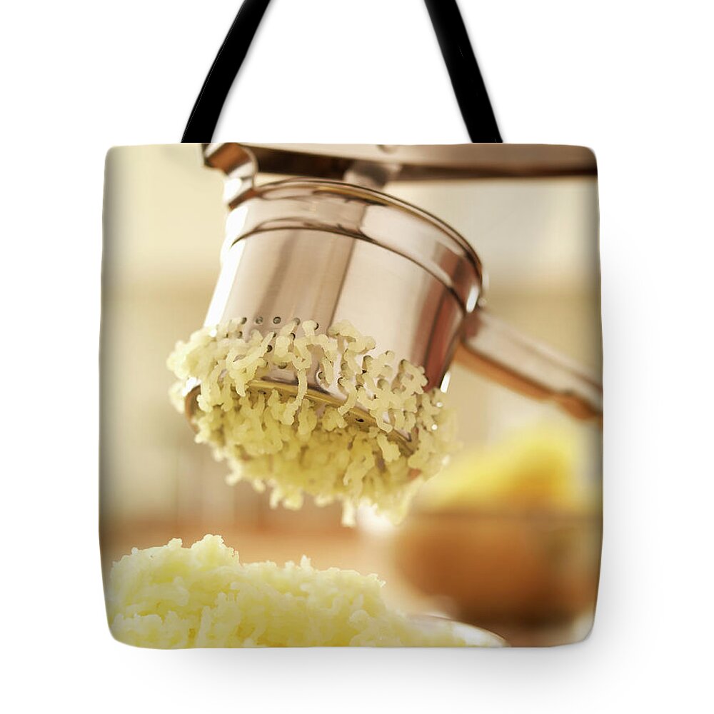 Close-up Tote Bag featuring the photograph Close Up Of Potato Ricer by Adam Gault