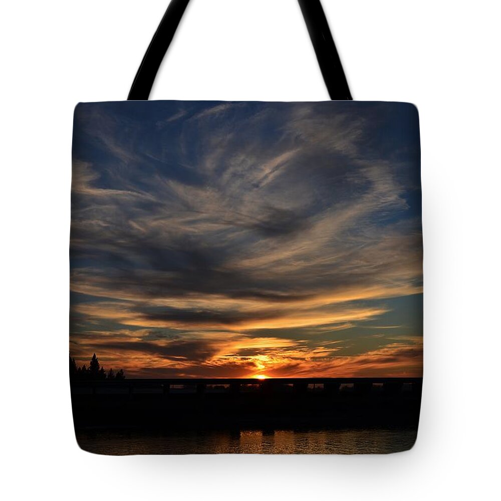 Sunset Tote Bag featuring the photograph Cloud Swirl Sunset by Marilyn MacCrakin