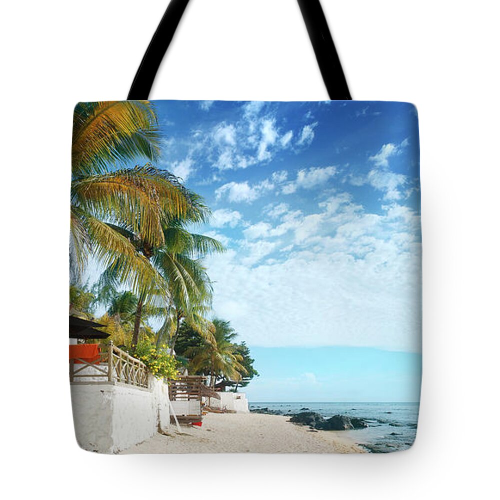 Water's Edge Tote Bag featuring the photograph Coconut Palms And Beach At Mauritius by Narvikk