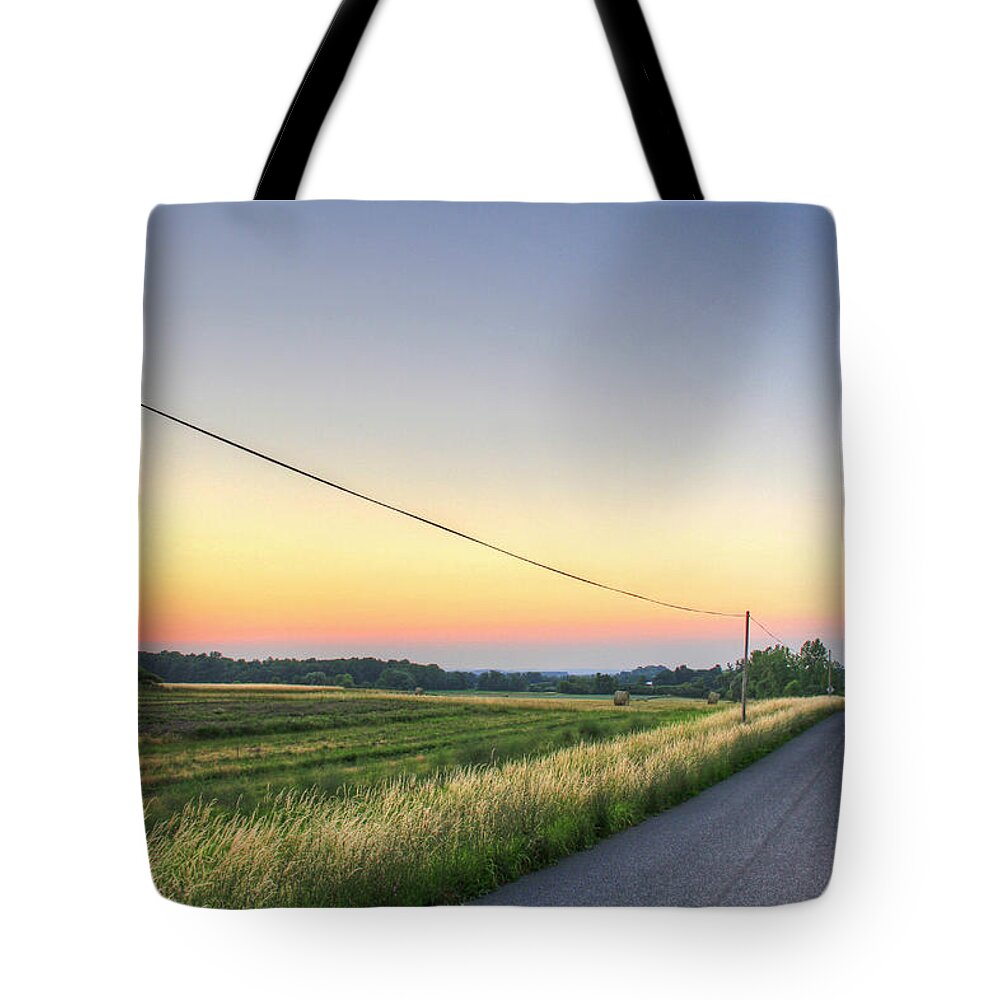 Outdoors Tote Bag featuring the photograph Country Road And Farms At Evening by Matt Champlin