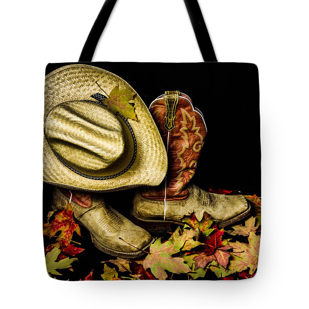 Cow Boots And Hat Tote Bag featuring the photograph Cow boots and hat by Gerald Kloss