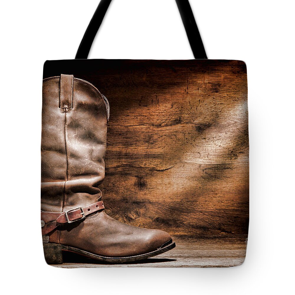 Cowboy Boots Tote Bag featuring the photograph Cowboy Boots on Wood Floor by Olivier Le Queinec