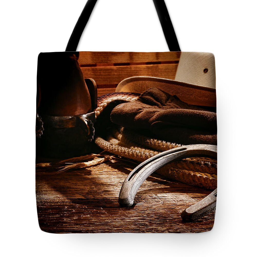 Western Tote Bag featuring the photograph Cowboy Horseshoe by Olivier Le Queinec