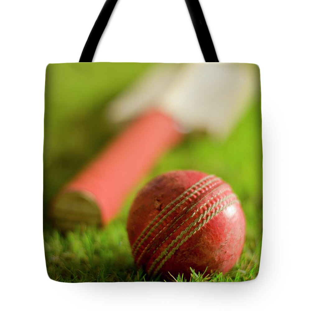 Grass Tote Bag featuring the photograph Cricket Ball And Bat by Haseeb Ahmed Khan