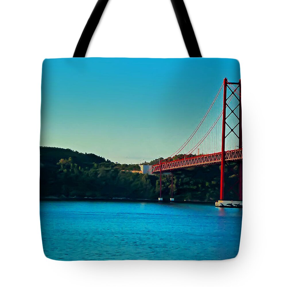 Lisbon Tote Bag featuring the photograph Cristo Rei and the 25 de Abril Bridge by Mitchell R Grosky