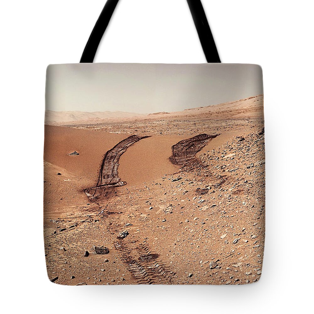 Curiosity Mars Rover Tote Bag featuring the photograph Curiosity tracks under the sun in mars by Weston Westmoreland