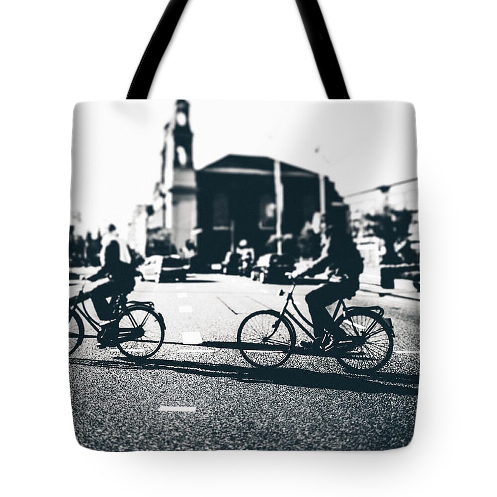 Cycling The City Of Amsterdam Tote Bag by Photos.com
