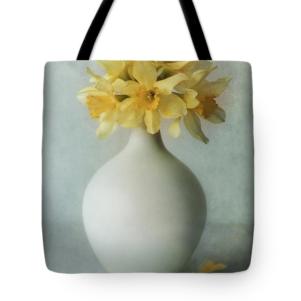 Flowers Tote Bag featuring the photograph Daffodils in a white flowerpot by Jaroslaw Blaminsky