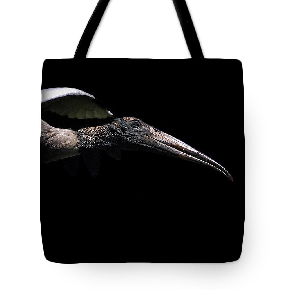 Stork Tote Bag featuring the photograph Dark Flight by Ghostwinds Photography