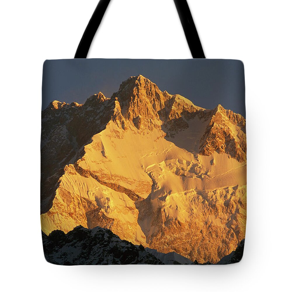 Hh Tote Bag featuring the photograph Dawn On Kangchenjunga Talung Face by Colin Monteath